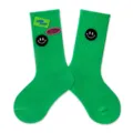 Green kids mid-calf socks with cute smiley patches and trendy street style letters. - Green