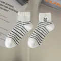 Cute women mid-calf socks with black white stripes, distressed cuffs and bear embroidery. - White Bear