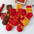 Thickened coral fleece winter New Year socks for women, festive red blessing floor socks. - One Size / Multicolor