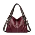 Fashionable color-blocked soft leather women's tote bag with shoulder strap and contrast stitching. - Burgundy