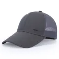 Detailed close-up of the dark grey mesh baseball cap showing metallic logo and breathable fabric. - Adjustable / Gray