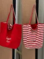 Vista dettagliata della borsa tote reversibile rossa e bianca, con lati a righe e tinta unita. - Design reversibile / Rosso Doppia Faccia