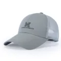 Close-up detail of gray mesh baseball cap with front embroidered letter text design. - Adjustable / Gray