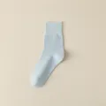 Minimalist solid color mid-tube combed cotton women socks in light blue breathable design. - One Size / Light Blue