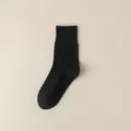 Solid black mid-tube combed cotton socks, seamless spring and summer basic daily wear main view. - One Size / Black