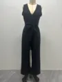 Combinaison noire sans manches à col V et jambe large avec nœud à la taille pour femmes. - S / Combinaisons / Noir