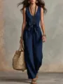 Detailed view of the stylish sleeveless V-neck linen jumpsuit with waist bow and wide legs. - S / Jumpsuits / Navy Blue