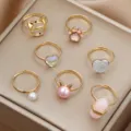 Set de 7 anillos ajustables bonitos para niños con orejas de gato corazones y perlas. - Serie Moda Dulce Bullet (7 Piezas)