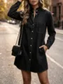 Dark denim shirt dress detail, featuring a ruffle stand collar, snap buttons, and side pockets. - S / Dresses / Black