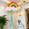 Rainbow balloon arch kit with colorful long balloons and white cloud balloons for party decor. - Matte Rainbow White Cloud Balloon Style C