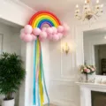 Rainbow balloon arch kit with pink cloud and colorful ribbons for birthday party decor. - Matte Rainbow Macaron Pink Cloud Balloon Style E