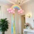 Rainbow balloon arch kit with pink cloud balloons and ribbons for birthday party scene decor. - Macaron Rainbow Macaron Pink Cloud Balloon Style F