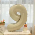 Caramel cream number 9 foil balloon for baby first birthday party and celebration setup. - Cream Number 9