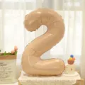 Caramel cream number 2 foil balloon for baby first birthday party celebration decor setup. - Caramel Number 2