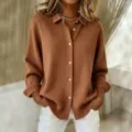 Detailed view of women's long sleeve knitted button-down cardigan shirt in casual autumn brown. - Caramel