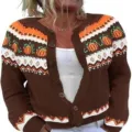 Close-up detail view of the brown knitted cardigan featuring decorative pumpkin and geometric motifs. - S / Tops / Brown Pumpkin