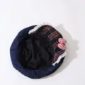 Detailed view of children denim beret featuring cute plaid patch and delicate lace trim. - Dark Plaid Bowknot