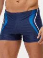 Herren Badehose Detailansicht mit blauem Waben Muster und kontrastierenden Paspeln. - S / Marineblau