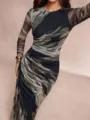 Detailed view of the elegant abstract print long sleeve dress, highlighting the slim fit. - Black