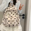 Detail view of Korean polka dot backpack, showing cute lace pearl bow and smooth zipper. - Pearl Lace Bow / Champagne