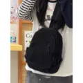 Casual black mini backpack for women, lightweight nylon daily sling chest bag and travel daypack. - Black