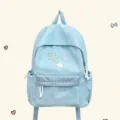 Zaino per studenti azzurro chiaro con toppe a stella carine e tasca a quadri per la scuola. - Blu