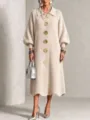 Detailed view of the elegant ribbed knit midi dress featuring large gold tone buttons. - S / Dresses / Off White