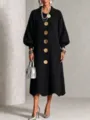 Detailed closeup view of women's long sleeve knit dress featuring large gold buttons. - S / Dresses / Black