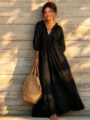 Detail view of a black boho long sleeve V-neck maxi dress with pleated and lantern sleeve design. - XS / Dresses / Black