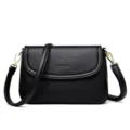 Zwarte lederen schoudertas voor dames, klassieke crossbody tas met gouden hardware. - Zwart