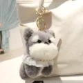 Grazioso portachiavi in peluche schnauzer grigio con colletto in pizzo bianco e gancio dorato - Charm / Grigio