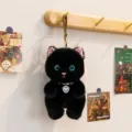 Portachiavi gatto in peluche nero con occhi blu scintillanti e collana di perle. - Gatto Devon Rex