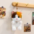 Cute plush cat keychain with pearl necklace and heart pendant, soft stuffed animal bag pendant charm. - Calico Cat