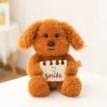 Cute brown curly puppy plush toy holding a smile card, soft healing doll companion for kids. - Holding Notebook Style