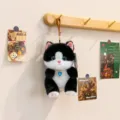 Adorable black and white plush stuffed toy keychain with blue heart crystal pendant. - Milk Cat