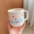 Cute ceramic mug with colorful polka dots and plaid pattern, ergonomic handle for daily use. - Mouthwash Cup
