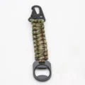 Tactical paracord keychain with carabiner and bottle opener, durable outdoor gear detail view. - Army Green Camo