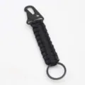 Black paracord keychain with metal carabiner clip and ring, durable outdoor braided pendant view. - Black