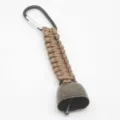 Outdoor camping bear bell detail, brown paracord lanyard with metal carabiner and bronze bell. - Brown