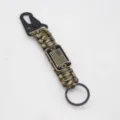 Detail view of tactical paracord keychain with metal carabiner and American flag plate. - Army Green Camo