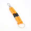 Paracord keychain detail showing orange and black woven nylon cord with silver metal hook. - Orange & Black