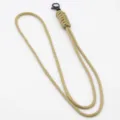 Close up detail of khaki paracord lanyard with black metal clasp for keys and ID cards. - Khaki
