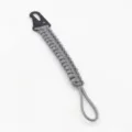 Gray paracord keychain with black metal carabiner for outdoor sports and daily carry use. - Gray