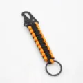 Porte-clés en paracorde noire et orange avec mousqueton en métal pour accessoires d'extérieur. - Orange Et Noir