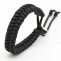 Handmade black paracord bracelet with adjustable metal slider for men and women daily wear. - Black