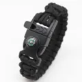 Black paracord survival bracelet with compass, whistle and plastic buckle for outdoor adventure. - Black