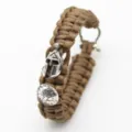 Survival paracord bracelet with metal Spartan helmet charm and adjustable shackle clasp. - Brown