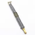 Grey paracord survival bracelet with brass shackle and American flag dog tag design variant. - Bronze Gray