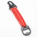 Red tactical paracord keychain with carabiner bottle opener for outdoor backpack gear - Red