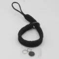 Detailed shot of hand-woven black paracord camera wrist strap with small metal rings. - Black
